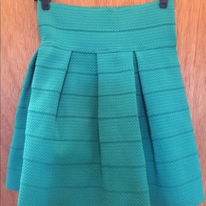 Emerald green stretch waist, Fit to flare skirt.